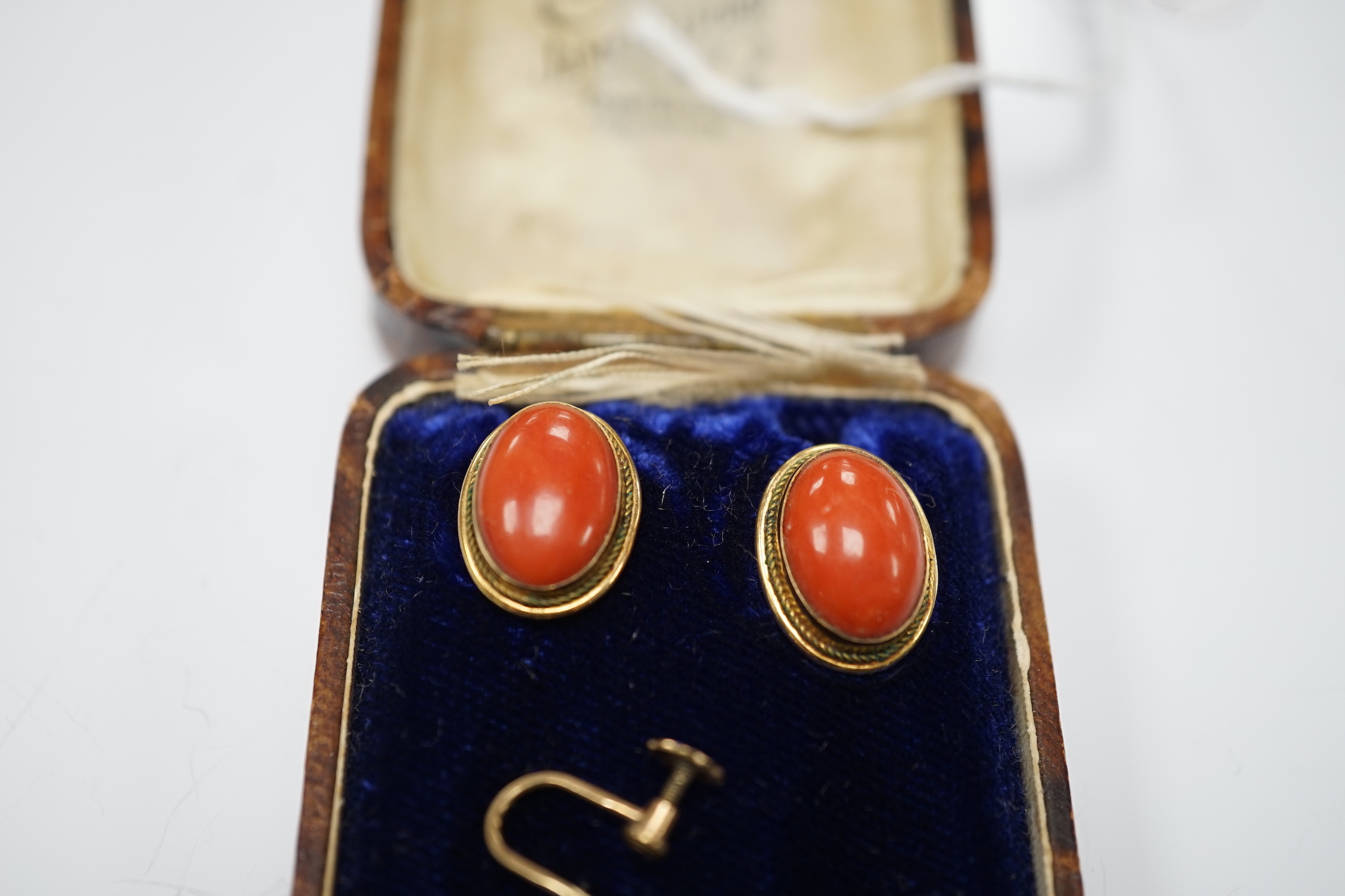 A pair of 750 yellow metal and cabochon coral set ear clips, 16mm and a pair of 9ct and single stone cultured pearl set ear clips.